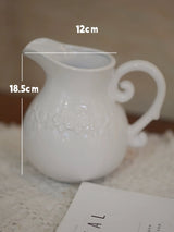 ピンクとライラックの人工フラワーアレンジメント（花瓶入り）