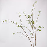 Artificial large snow willow branches with white blossoms, original studio background
