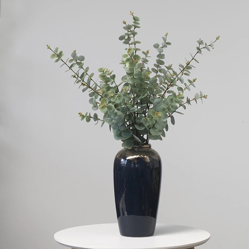 Artificial eucalyptus foliage styled in black vase