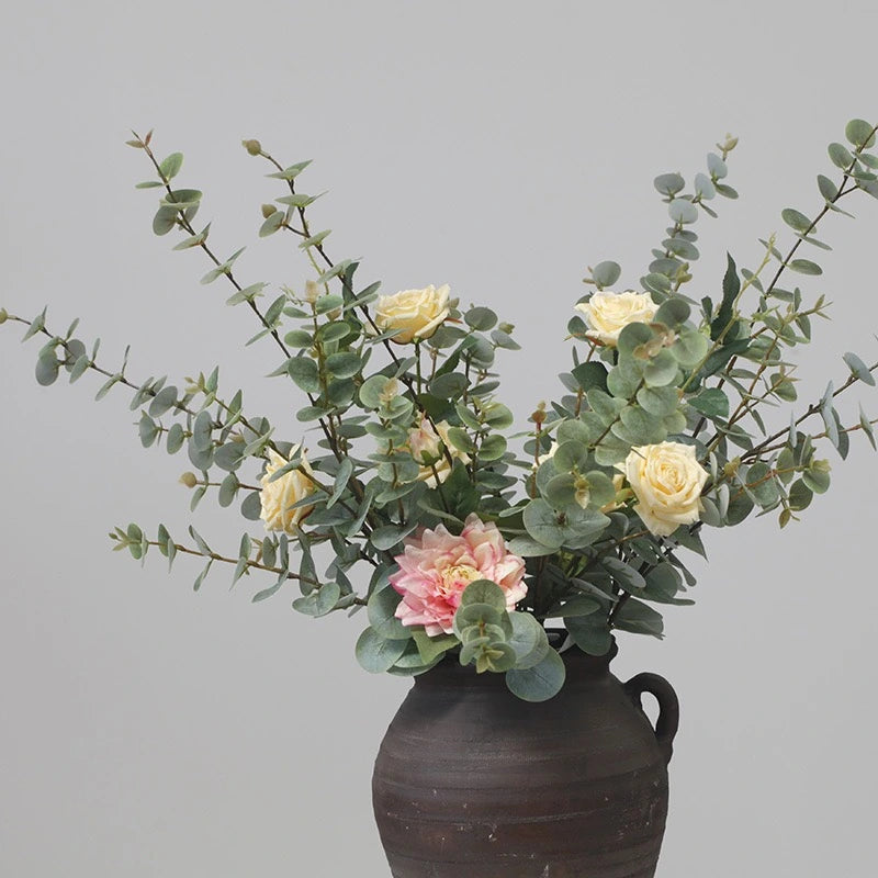Artificial eucalyptus in mixed flower arrangement