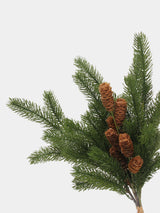 Detailed view of artificial pine foliage, brown cones and raffia-style stem tie