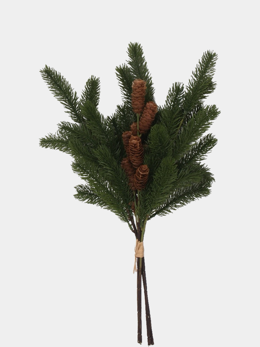 Green artificial pine branch with brown cones and tied stems, full-length view