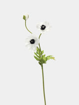 White artificial poppy stem with two open flowers, one bud and green leaves, 45 cm tall