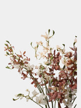 Faux autumn butterfly orchid stems styled together