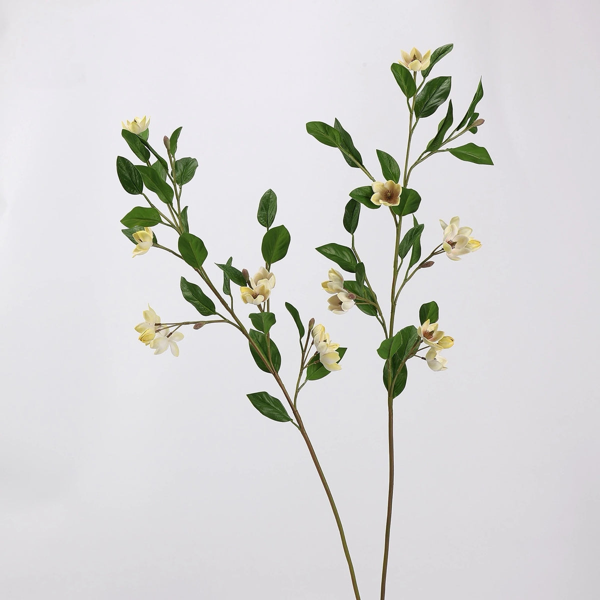 Pair of light yellow faux magnolia flower branches