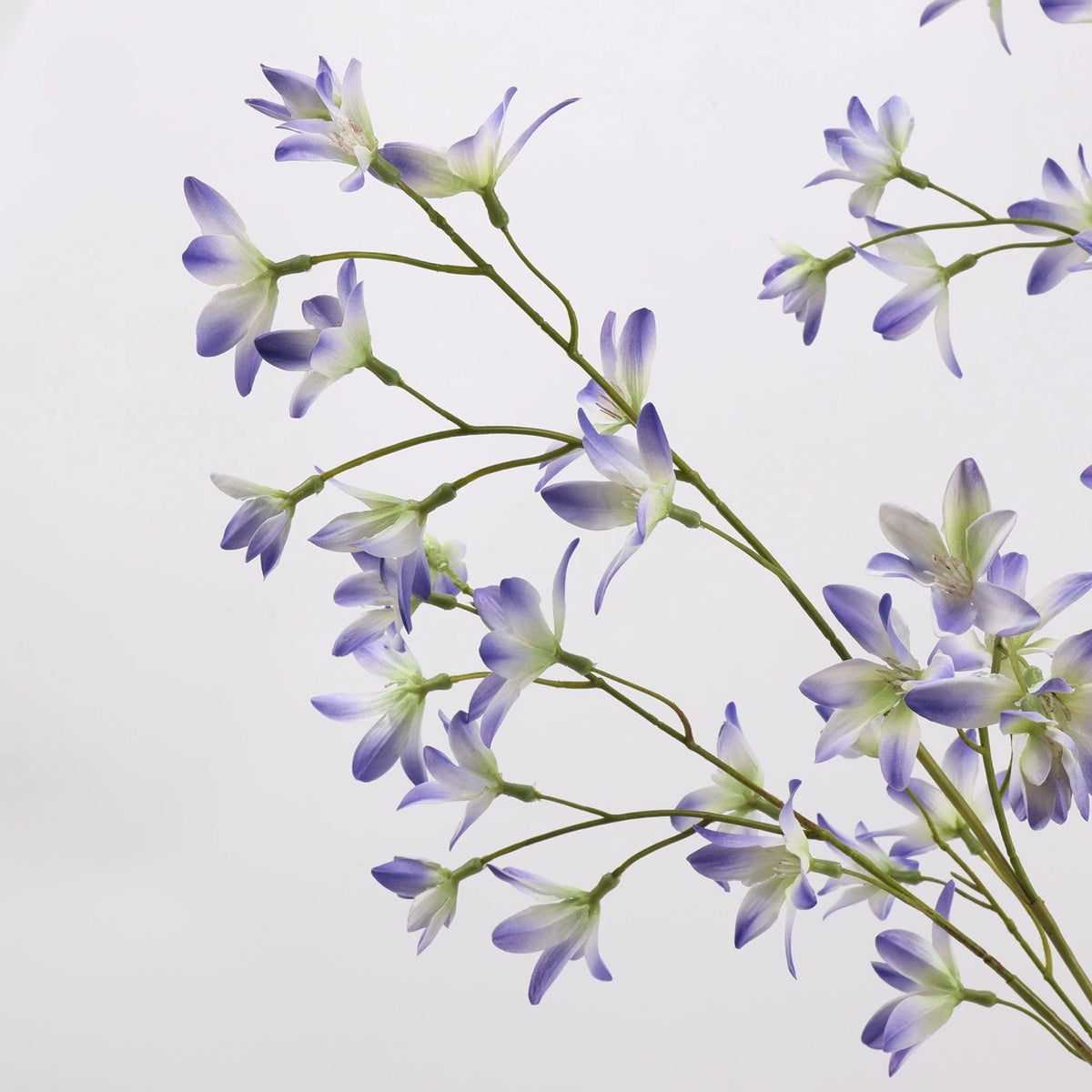 Purple faux flowering branch detail