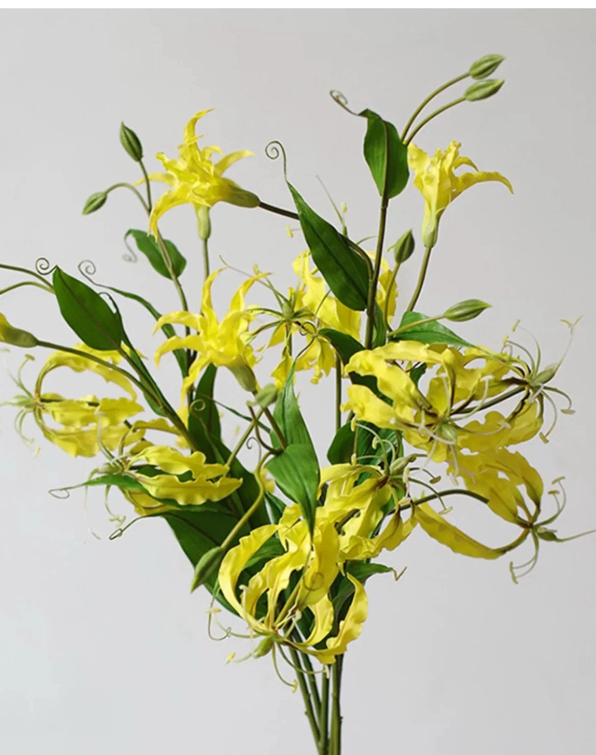 Yellow artificial gloriosa lily flower detail