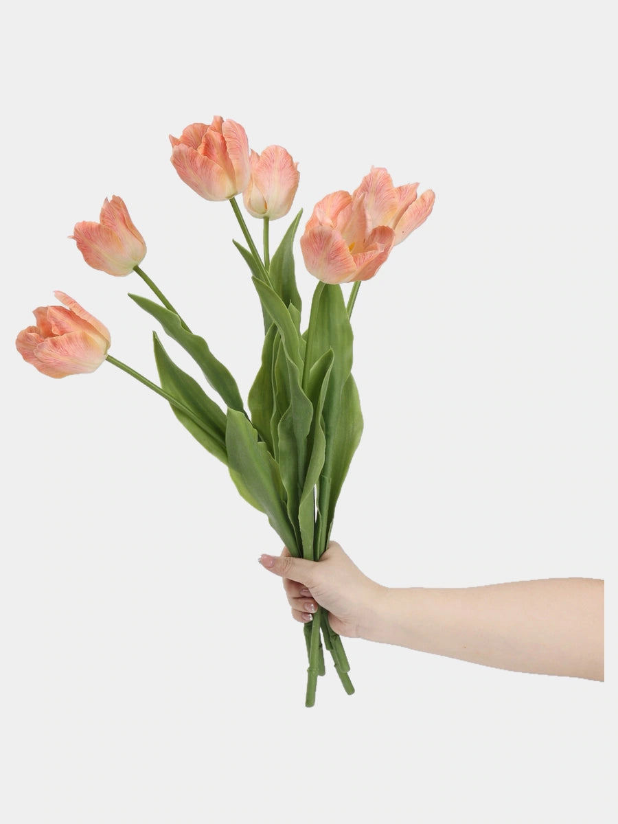 Apricot large Real Touch Armani tulip stems held in a hand