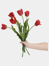 Red large artificial Armani tulip stems held together to show flower shapes and leaves