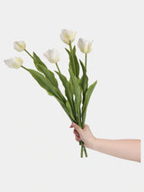 White large Real Touch Armani tulip stems held in a hand