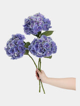 Real Touch Maillard Hydrangea – Blue Violet stems held in hand