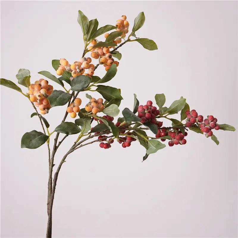 Orange and red faux berry branches together