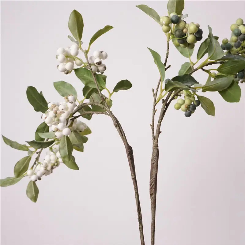 Green and white faux berry stems, side view